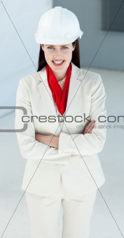 Attractive female architect with folded arms