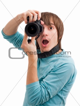 Young man surprised with photo camera