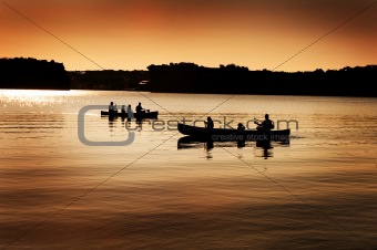 Silhouette of Canoers on Lake