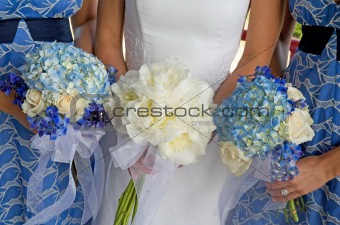 Bride and Two Bridesmaids Holding Bouquets