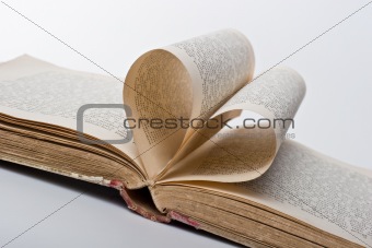 Pages of a book folded in to a heart shape 