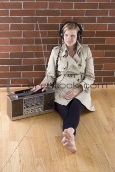 women listens to an old radio