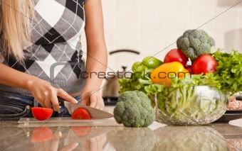 Woman Cutting Tomato