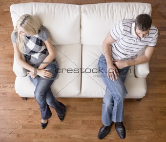 Young Couple Sitting on Love Seat