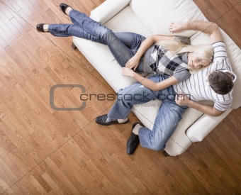 Young Couple Sitting on Love Seat