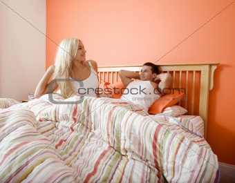 Young Couple Waking Up in Bed