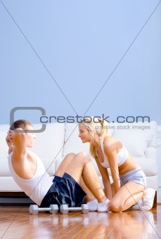 Couple Exercising on Living Room Floor