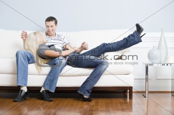 Affectionate Couple Relaxing Together on Couch