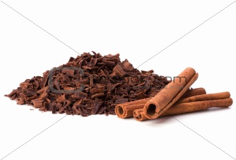 grated chocolate and cinnamon isolated on white background