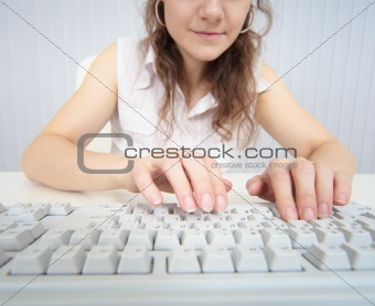 Woman working at computer keyboard