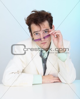Funny disheveled young man in glasses