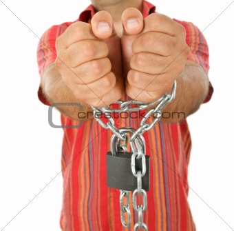 Man in chains - closeup, focus on hands