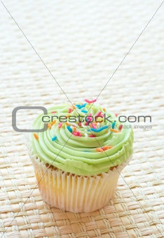 Vanilla cupcake with green lime icing