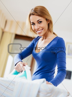 woman ironing shirt