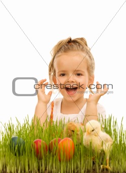 Little girl with easter eggs and baby chickens