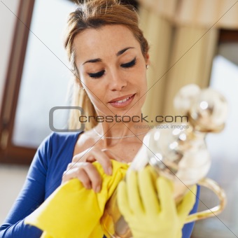 woman polishing silverware