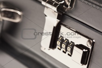 Abstract Close Up Shot of a Black Leather Briefcase Latch and Lock.