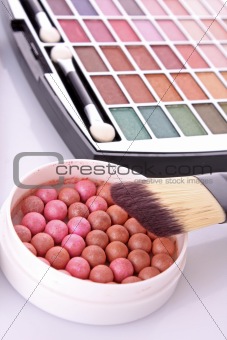 cosmetic brushes  brush , eye shadows and rouge  on white  backg