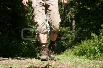 Legs with hiking boots of a wanderer