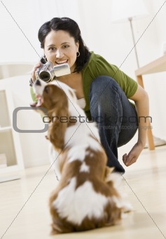 Woman Video Taping Dog
