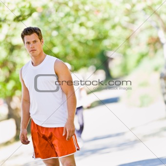 Runner standing in park
