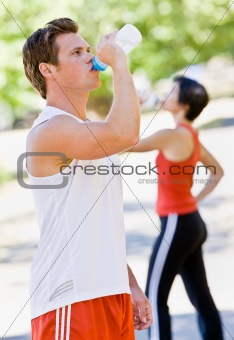 Runner drinking water