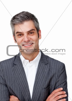 Assertive mature businessman with folded arms 