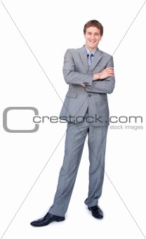 Enthusiastic businessman standing with folded arms 