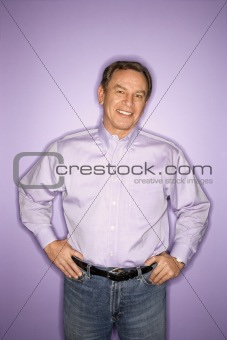 Caucasian man wearing purple clothing.