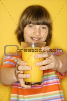 Caucasian boy with glass of orange juice.