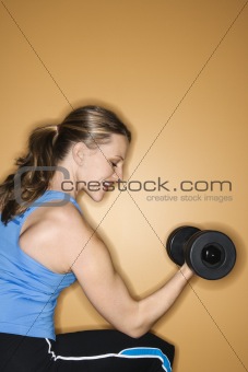 Adult female lifting hand weights.