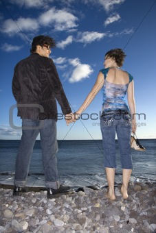 Couple Holding Hands on Beach