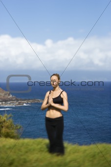 Attractive Young Woman Standing in Meditation