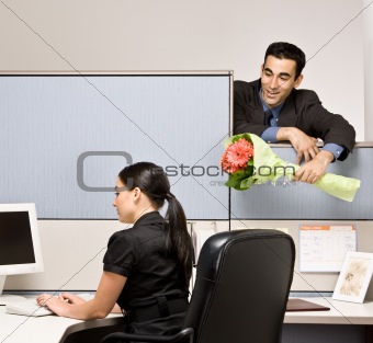 Businessman bringing co-worker flowers