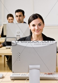 Businesswoman typing on computer