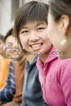 Woman Smiling in Group of People