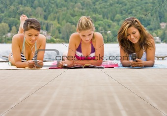 Friends laying on pier