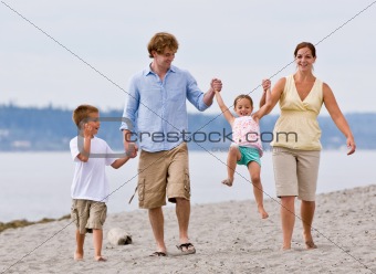 Family playing at beach
