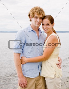 Couple hugging at beach