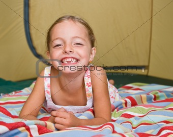 Girl laying in tent