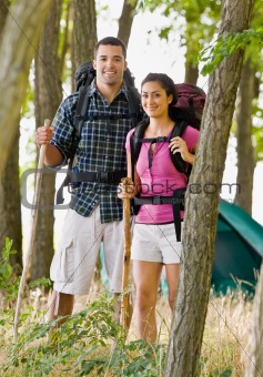 Couple in backpacks hiking