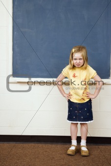 Girl with Sad Expression in Classroom