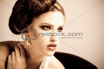Attractive Young Woman Wearing Pearls