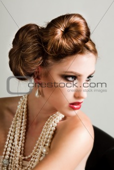 Attractive Young Woman Wearing Pearls