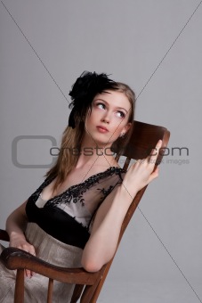 Attractive Young Woman Sitting in a Rocking Chair