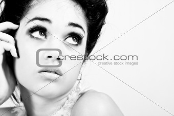 Glamorous Young Woman Looks to the Side. Isolated