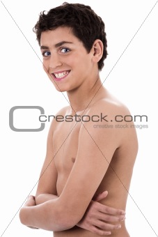 Boy giving strange expression and smiling