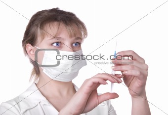 Young nurse in mask with syringe, isolated on white 