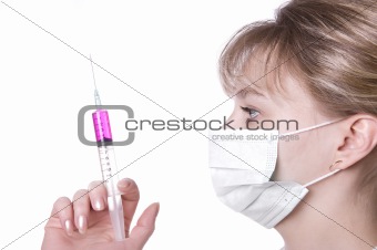 female doctor with mask holding syringe on a white background