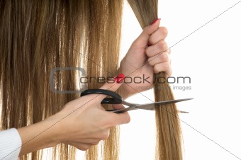 scissors trying to cut long hair